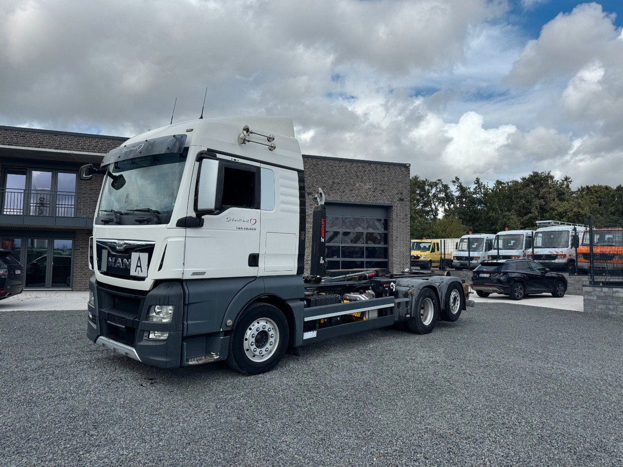 MAN TGX 26.520 D38 Abrollkipper Multilift - Hook lift truck: picture 2 MAN TGX 26.520 D38 Abrollkipper Multilift - Hook lift truck: picture 2