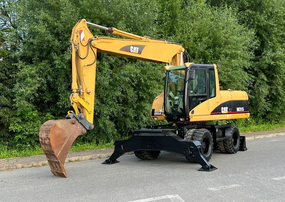 Caterpillar CAT M315C CATERPILLAR SPROWADZONY Bardzo Dobry Stan - Wheel excavator: picture 1 Caterpillar CAT M315C CATERPILLAR SPROWADZONY Bardzo Dobry Stan - Wheel excavator: picture 1